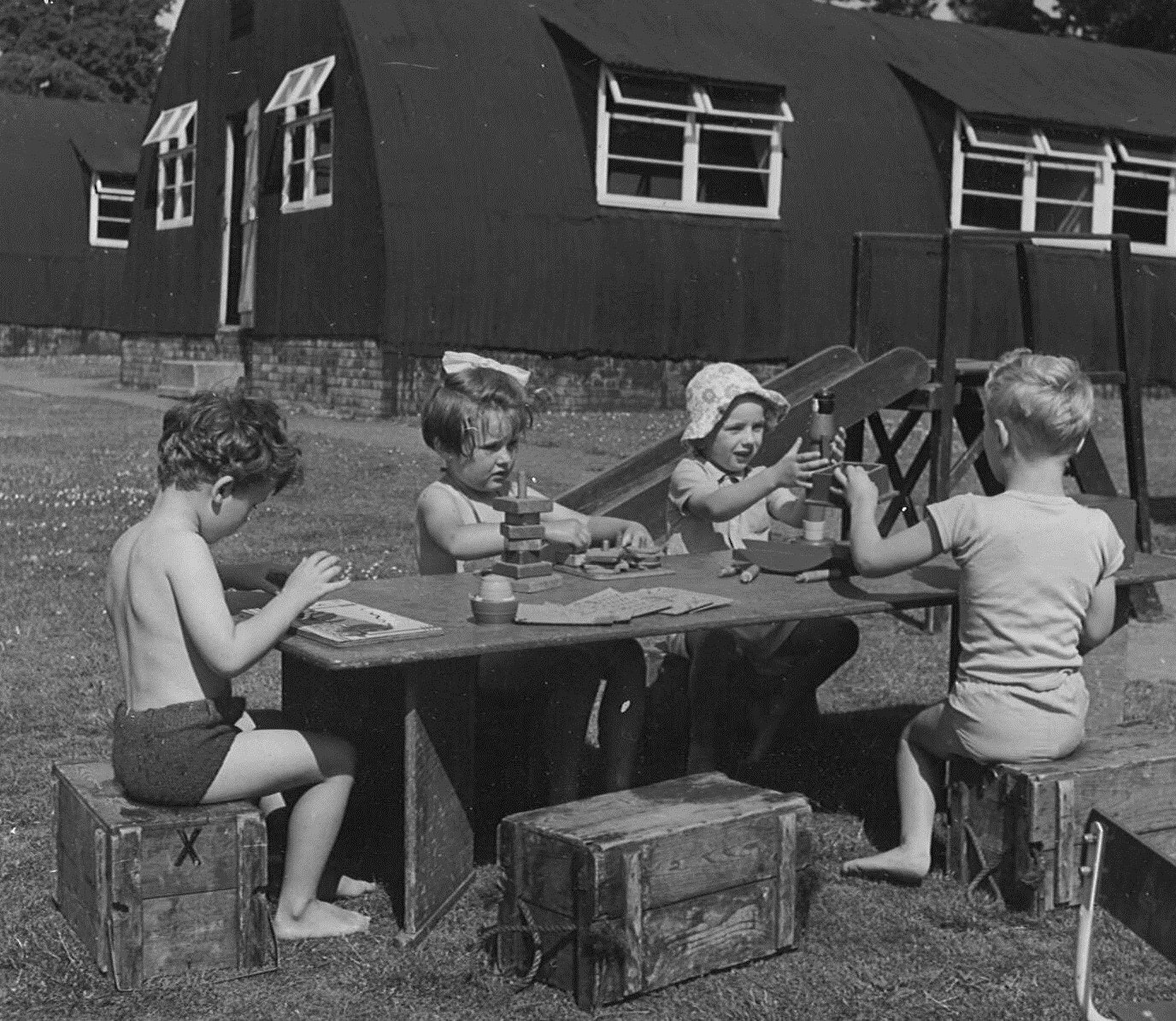 Practising school Wimbledon, circa 1950, using army Nissen huts for classrooms